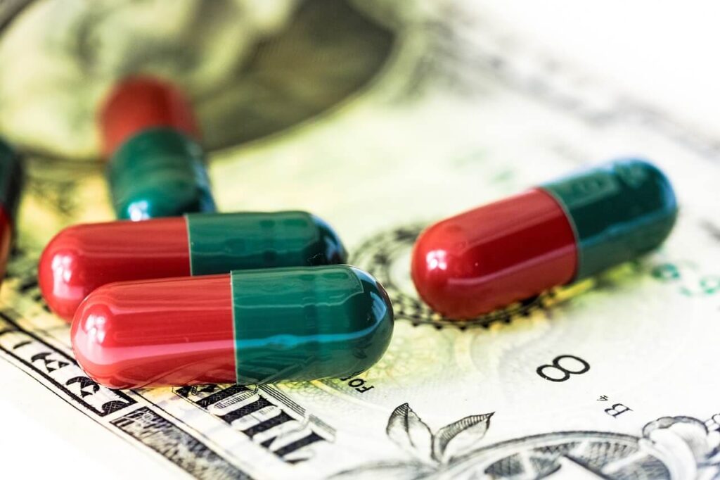 Pills on top of a dollar bill